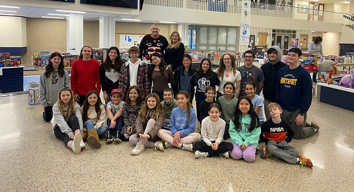 Members of the Our Town community service club and their high school counterparts and advisors.