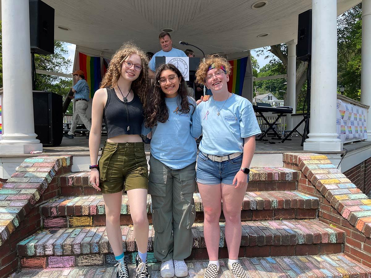 Northport High School students Sadie Callahan, Anna Tumbarello and Ethan Soda spoke at Northport Pridefest in front of hundreds of attendees, telling their personal stories and expressing their gratitude for such an event in their community. Soda said that experiencing Pride in Northport made his dream come true.