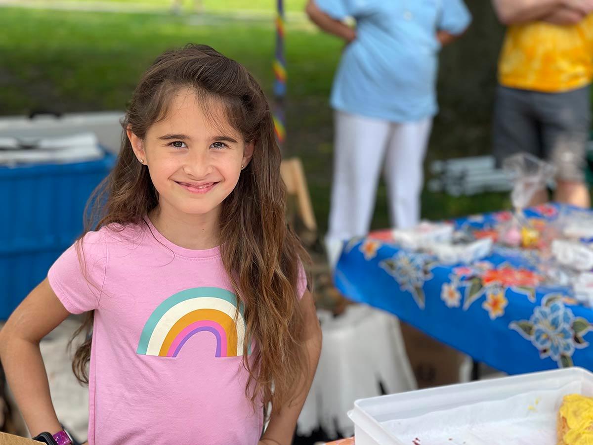 Second grader Ruby Kay volunteered at the Southdown Coffee table that gave out treats to Pridefest committee members and volunteers.