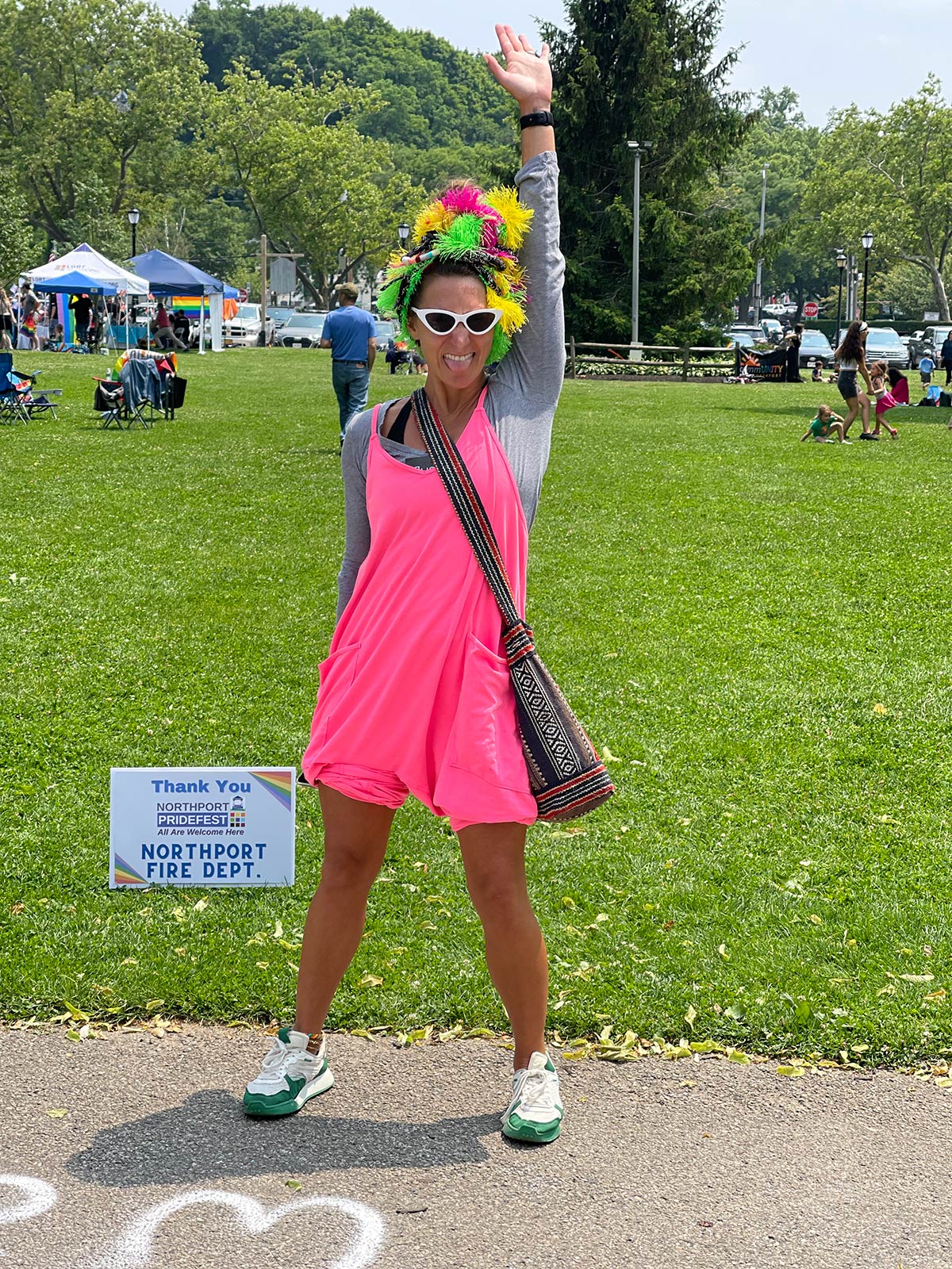 A Pridefest attendee roots on the speakers with joy and enthusiasm.