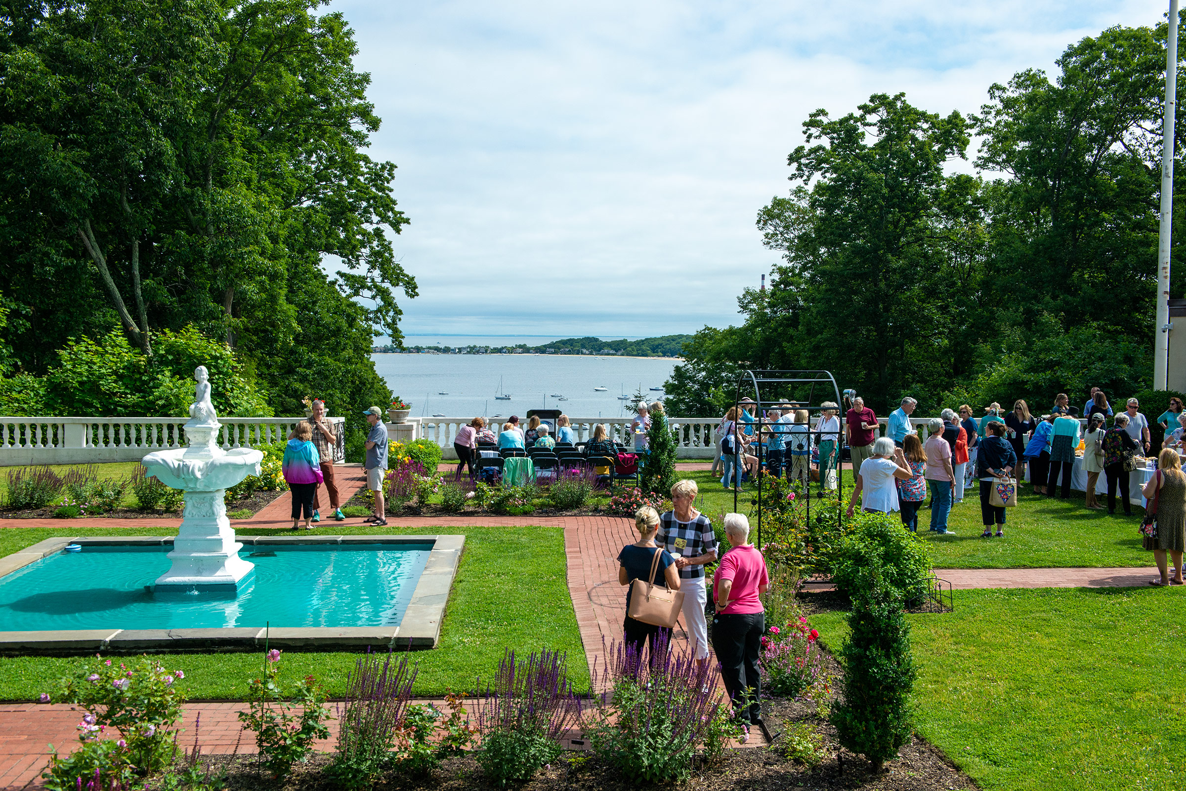 Members of the Centerport Garden Club gather before the official reopening of a historic rose garden at the Suffolk County Vanderbilt Museum and Reichert Planetarium.