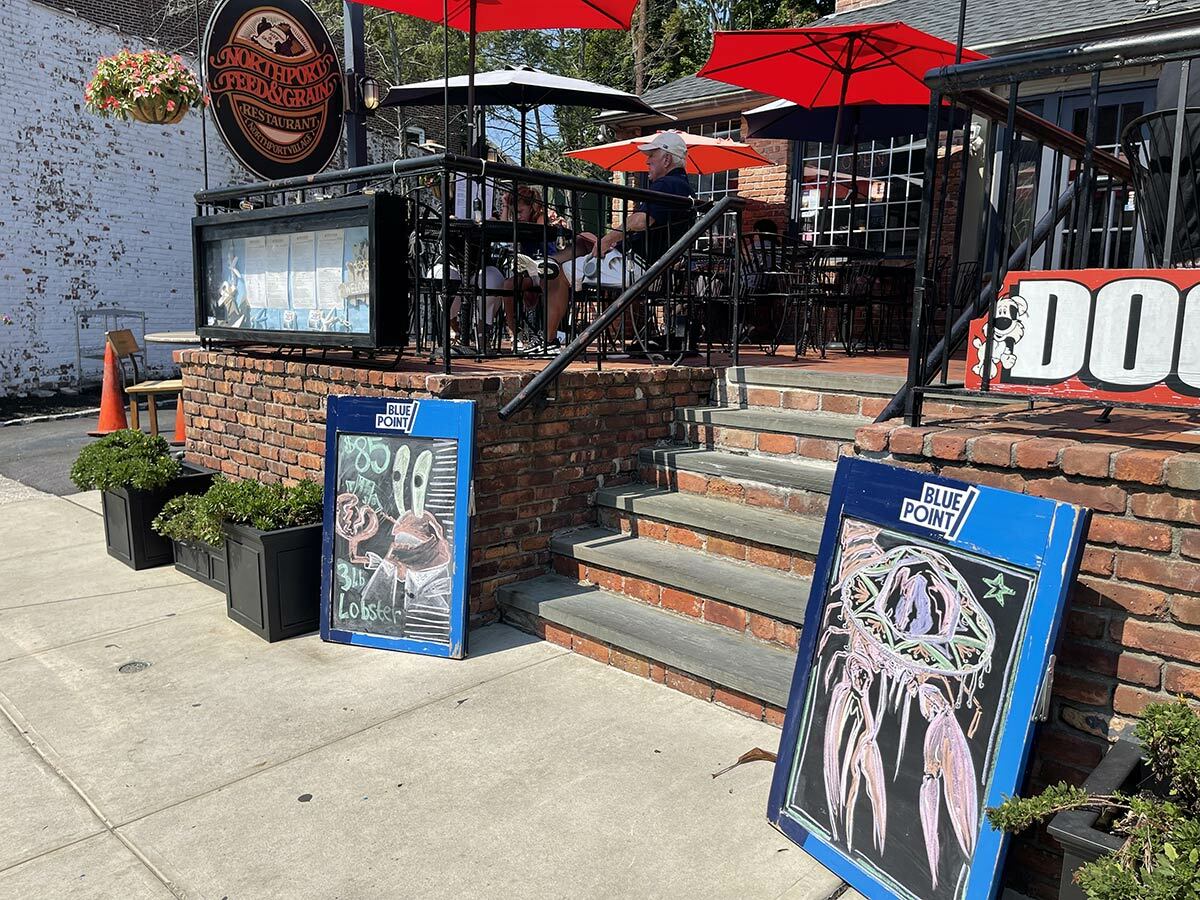 Sidewalk signs like these outside of the Northport Feed and Grain restaurant could be banned if a proposed law amendment is approved.
