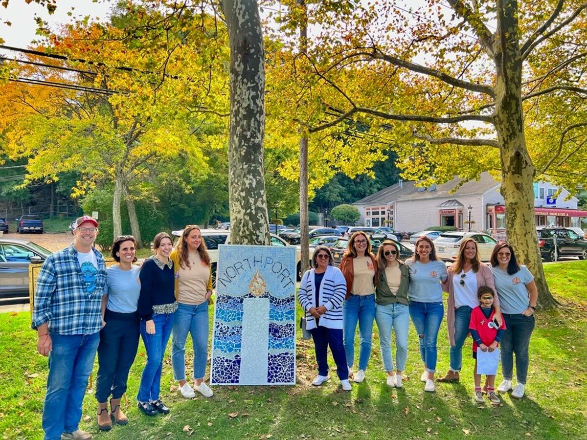 NIOT Northport co-founders presented a candlelight mural to Northport Village Mayor Donna Koch. Assemblyman Keith Brown joined in on the festivities.