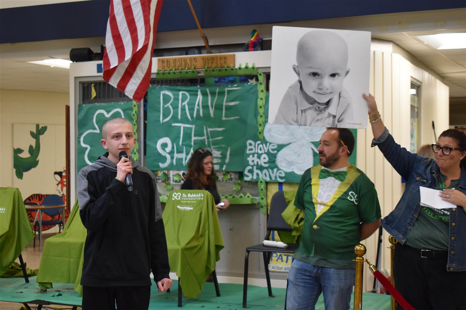 NHS student and cancer survivor Christian Sloan addresses the crowd after having his head shaved. Photo courtesy of the Northport-East Northport school district.