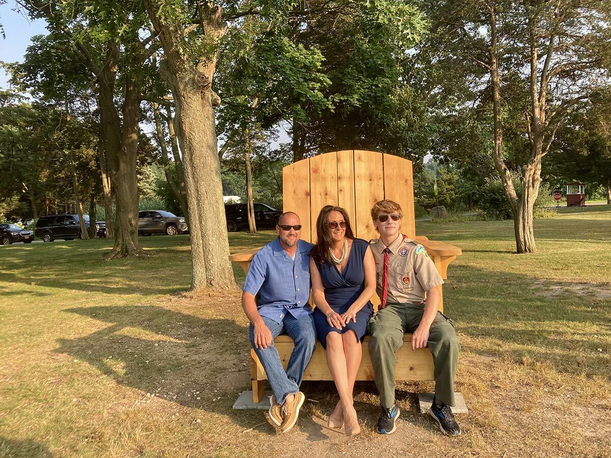 Trustee Dave Weber, former Trustee Mercy Smith, and Eagle Scout Thomas Serra at the July 27 dedication.