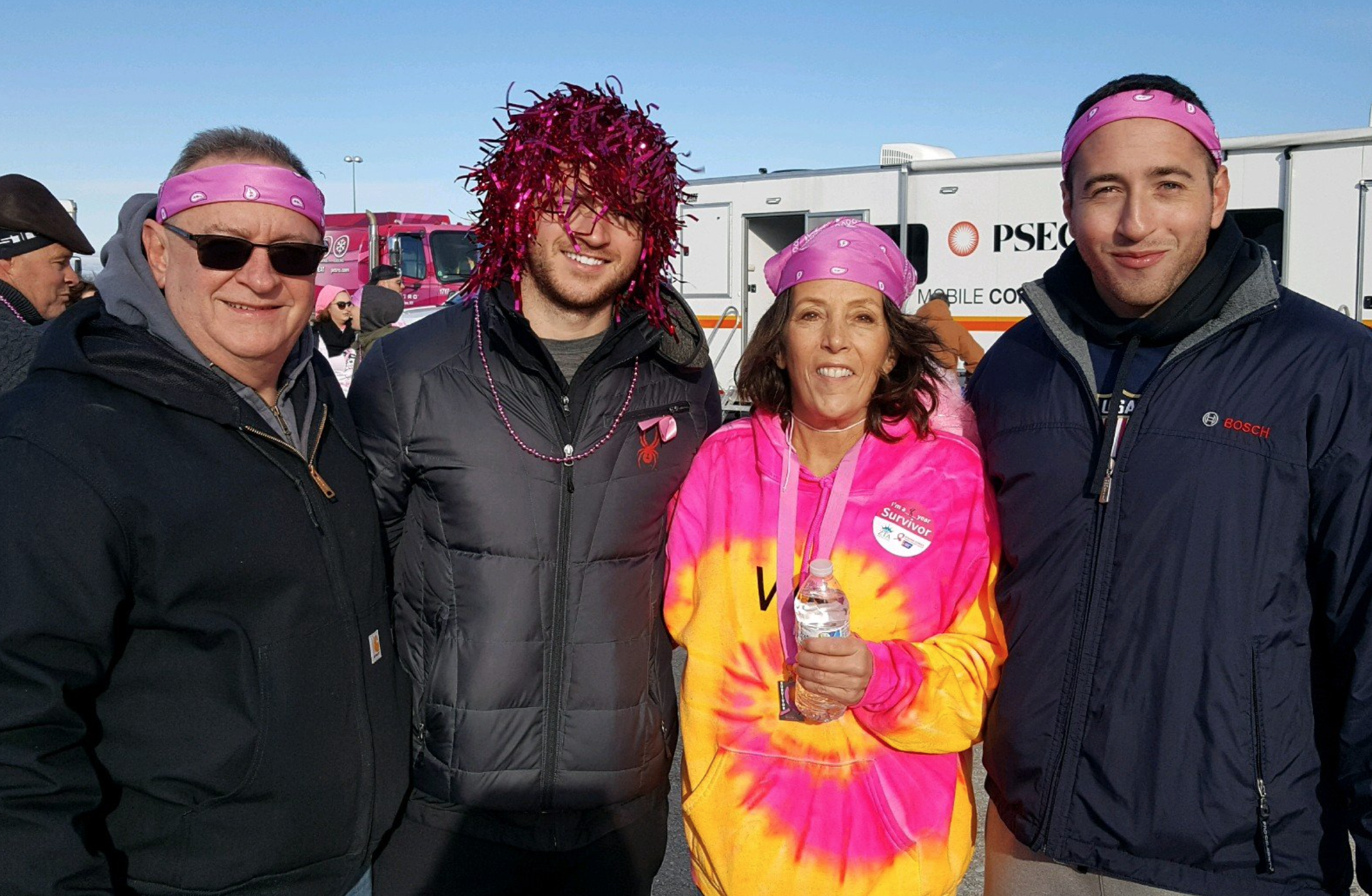 Northport resident and author of Along Came Cancer, Valerie Mortimer, with her husband Jim and their sons Ryan and Christopher, at a past “Making Strides Against Breast Cancer” event. Photo via Facebook.